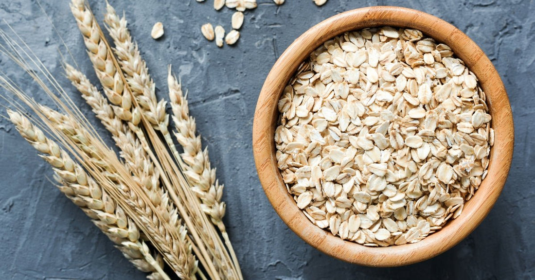 Close-up of colloidal oatmeal in a wooden bowl used in Edenwild Happy Baby Balm to help soothe eczema and calm sensitive skin