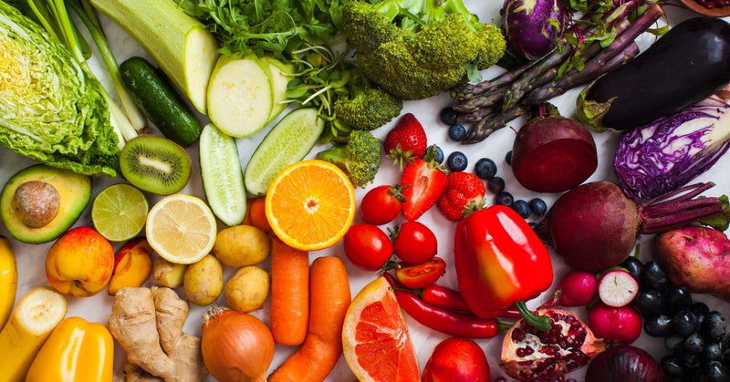 Colorful whole foods including vegetables and fruits that support healthy skin nutrition — Edenwild natural skincare
