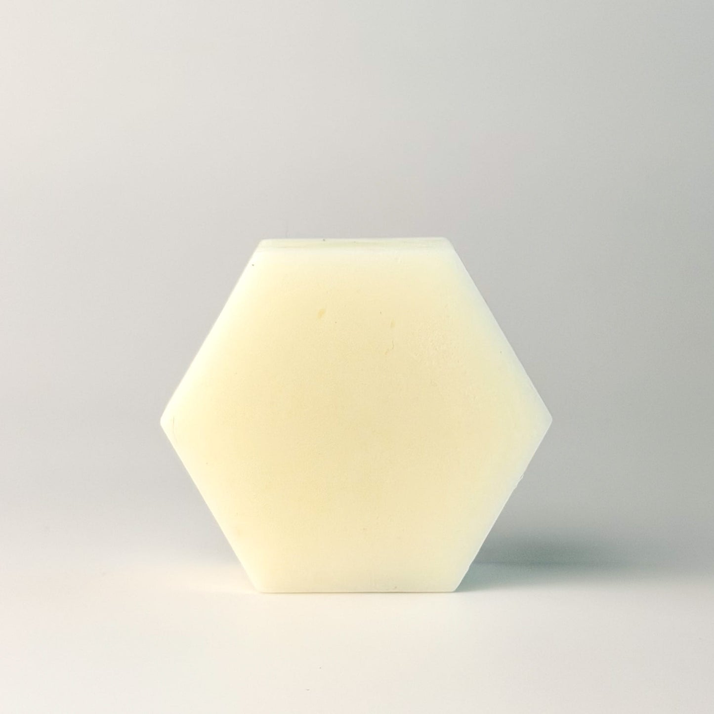 Edenwild Aire conditioner bar in hexagonal shape on white surface — sulfate-free solid conditioner bar for soft, moisturized, and frizz-free hair