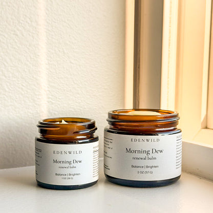 Edenwild Morning Dew tallow balm duo on windowsill in natural light — botanical skin renewal balms for brightening and barrier support - showcasing size variants