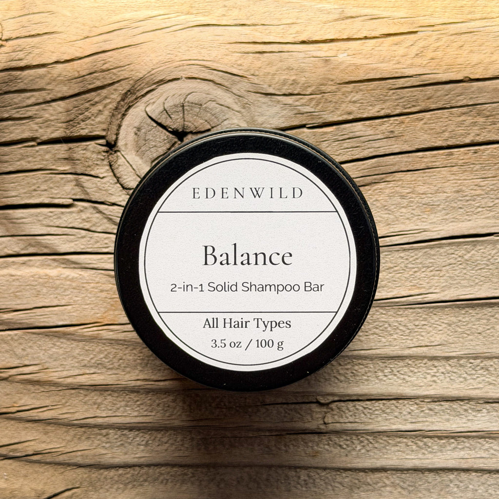 Edenwild Balance 2-in-1 Solid Shampoo Bar for all hair types, natural sulfate-free shampoo bar for oily and combination scalp, displayed on weathered wood