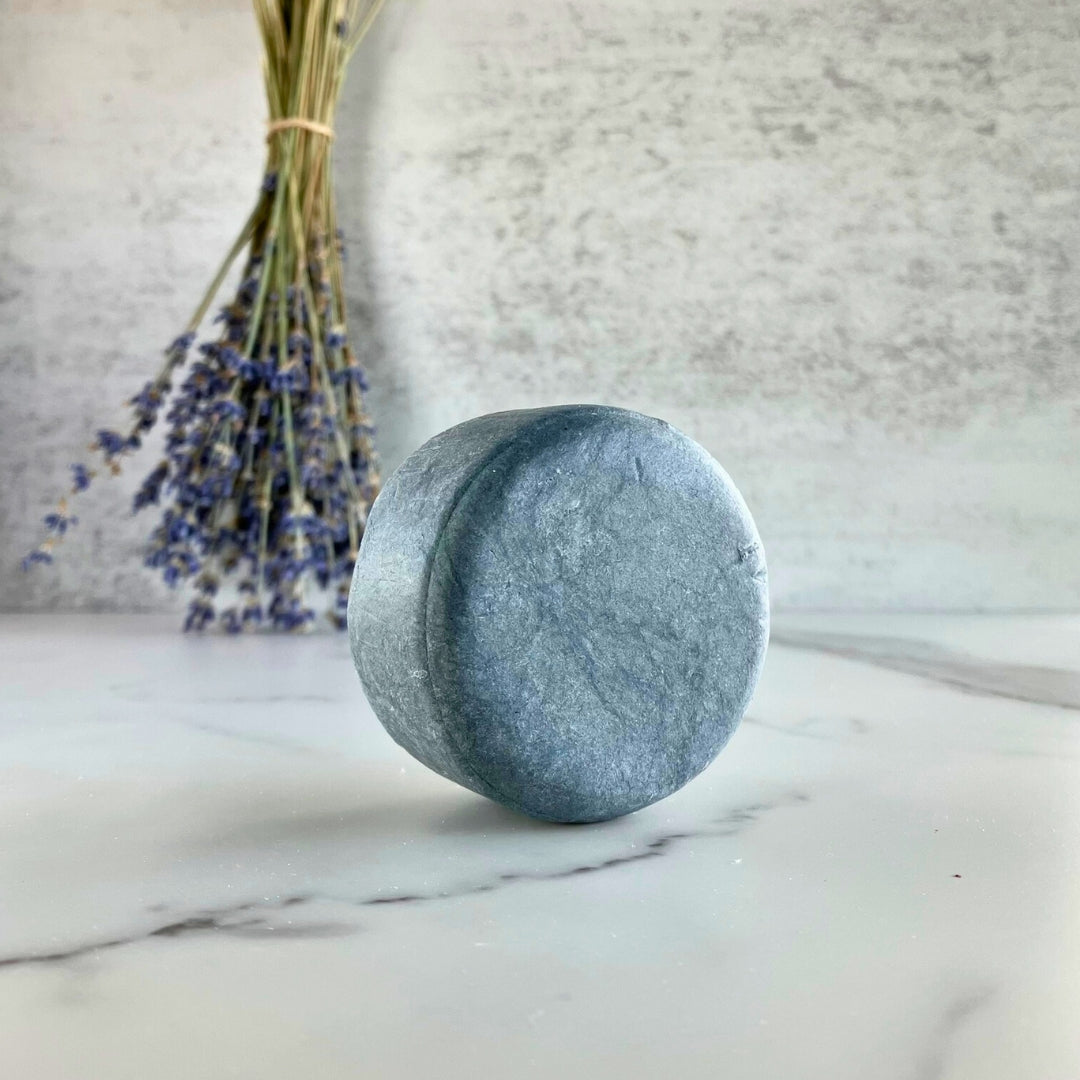 Charcoal natural shampoo bar scented with orange and lavender essential oils for hair detox by Edenwild Beauty.
