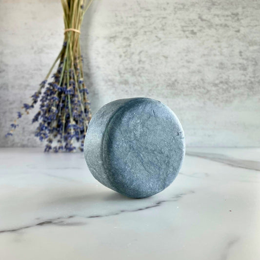 Charcoal natural shampoo bar scented with orange and lavender essential oils for hair detox by Edenwild Beauty.