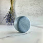 Charcoal natural shampoo bar scented with orange and lavender essential oils for hair detox by Edenwild Beauty.