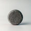 Edenwild Clarify shampoo bar in charcoal on white surface — activated charcoal sulfate-free solid shampoo bar for deep scalp cleansing and buildup removal