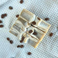Natural soap bars called Breakfast Scrub that cleanses gently while exfoliating with coffee grounds by Edenwild Beauty.