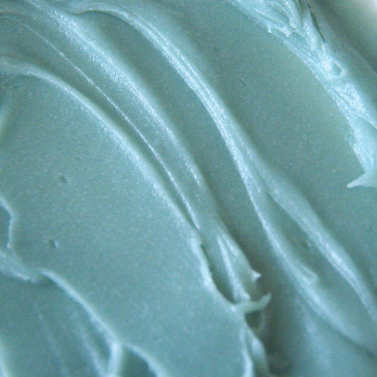 Close-up of rich, creamy blue tansy tallow balm texture used in Edenwild  Everything + Blue Tansy tallow balm to help calm inflammation and soothe irritated skin

