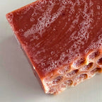Close-up of Edenwild Wildflower Garden soap bar showing natural rose clay texture and botanical ingredients