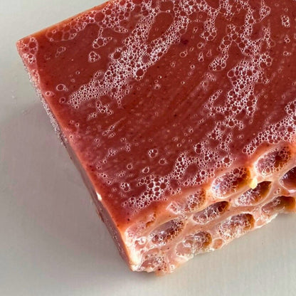 Close-up of Edenwild Wildflower Garden soap bar showing natural rose clay texture and botanical ingredients