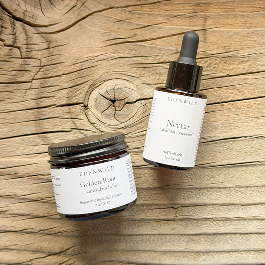 Edenwild Golden Hour Set — Golden Root Antioxidant Balm and Nectar Bakuchiol Serum on rustic wood grain — natural anti-aging skincare bundle