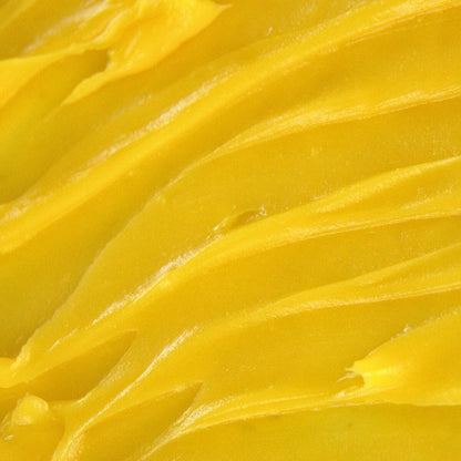 Edenwild Golden Root tallow balm texture on spatula — antioxidant-rich balm for dry skin, fine lines, and skin barrier restoration
