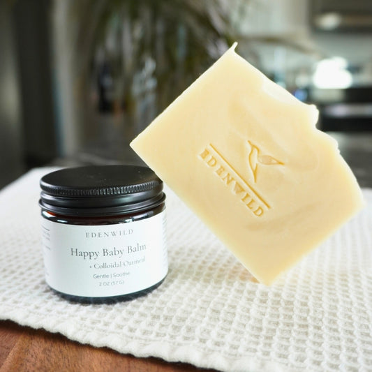 Styled product photo of Happy Baby Balm and Happy Baby Soap used in Edenwild Gentle Skin Duo to help soothe eczema and sensitive skin
