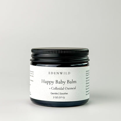 Edenwild Happy Baby Balm with colloidal oatmeal in amber jar on grey background — gentle balm for eczema, dry skin, and sensitive skin of all ages