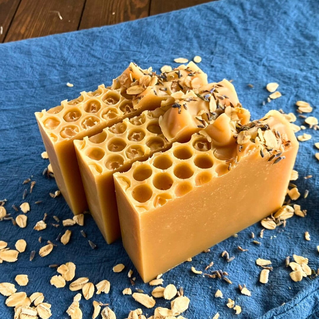 Top-down view of Edenwild Honey Lemon soap bars with honeycomb texture and rolled oats — honey oat bar soap to soothe and soften dry skin