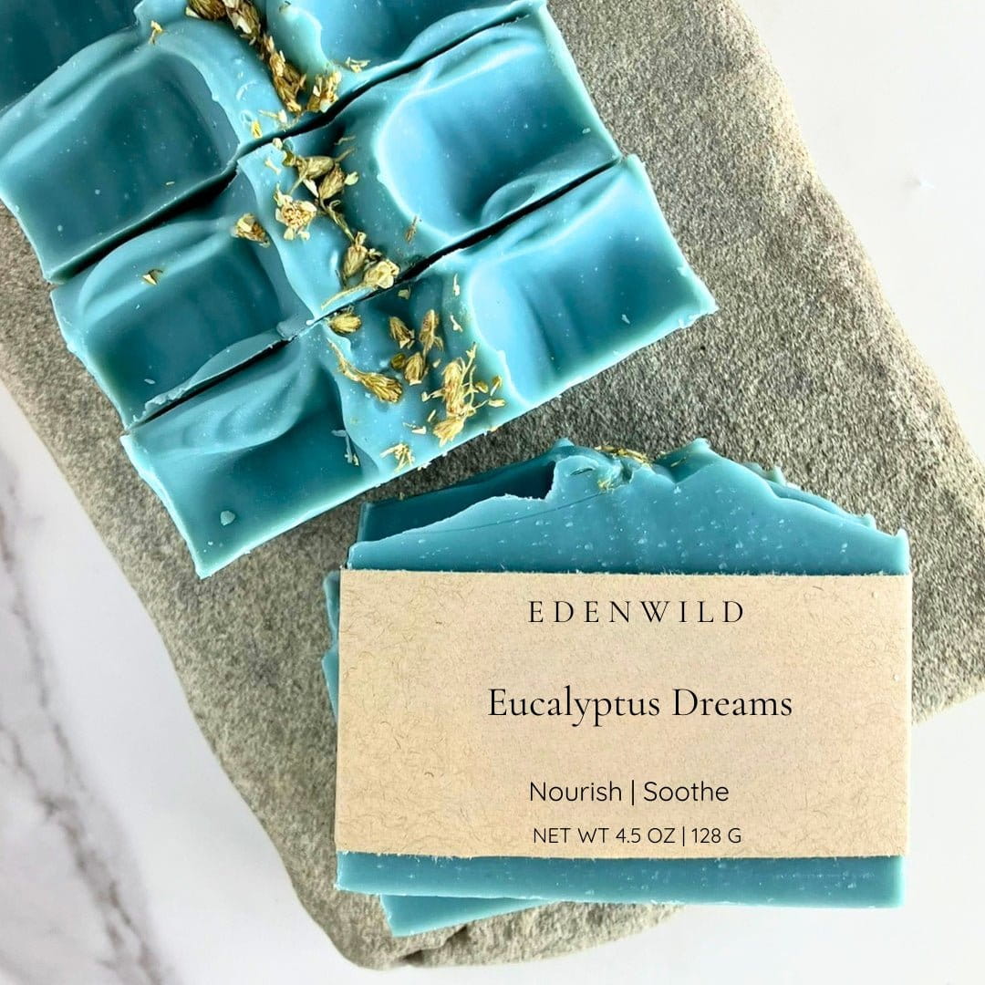 Top-down view of Edenwild Eucalyptus Dreams soap bars on natural rock with dried botanicals — eucalyptus bar soap for soothing and nourishing skin