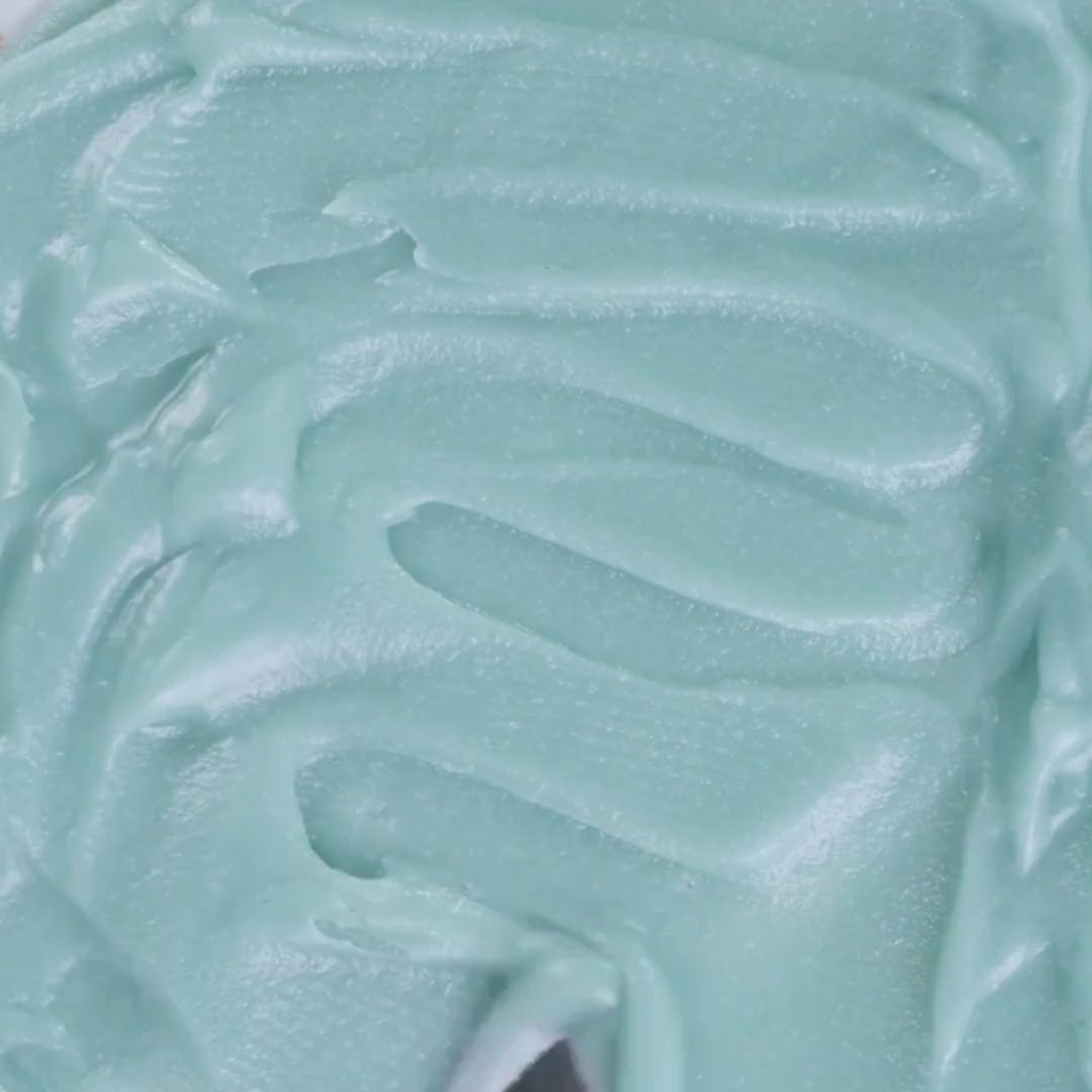 Spatula gliding through creamy grass-fed tallow balm used in Edenwild Everything Balm to help soothe and protect sensitive skin