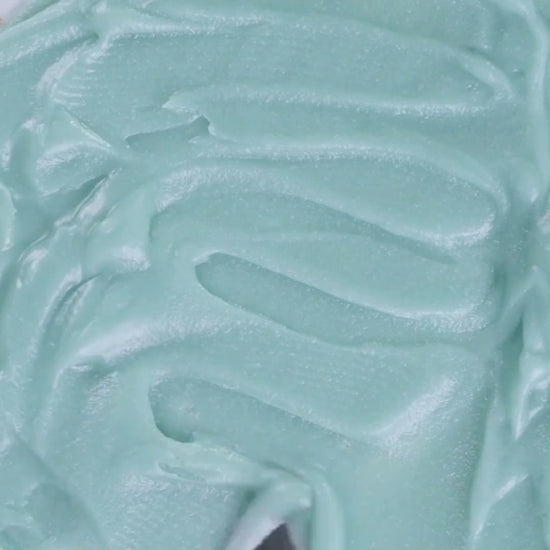 Spatula gliding through creamy grass-fed tallow balm used in Edenwild Everything Balm to help soothe and protect sensitive skin