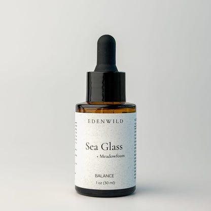 Edenwild Sea Glass serum facial serum in amber dropper bottle on grey background — botanical adaptogen serum for skin balance and barrier support