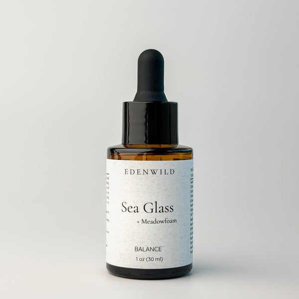 Edenwild Sea Glass serum facial serum in amber dropper bottle on grey background — botanical adaptogen serum for skin balance and barrier support
