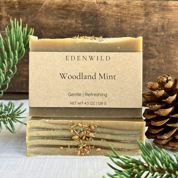 Edenwild Woodland Mint natural soap bars stacked with pine cone and fresh rosemary — gentle botanical bar soap for refreshing, everyday cleansing